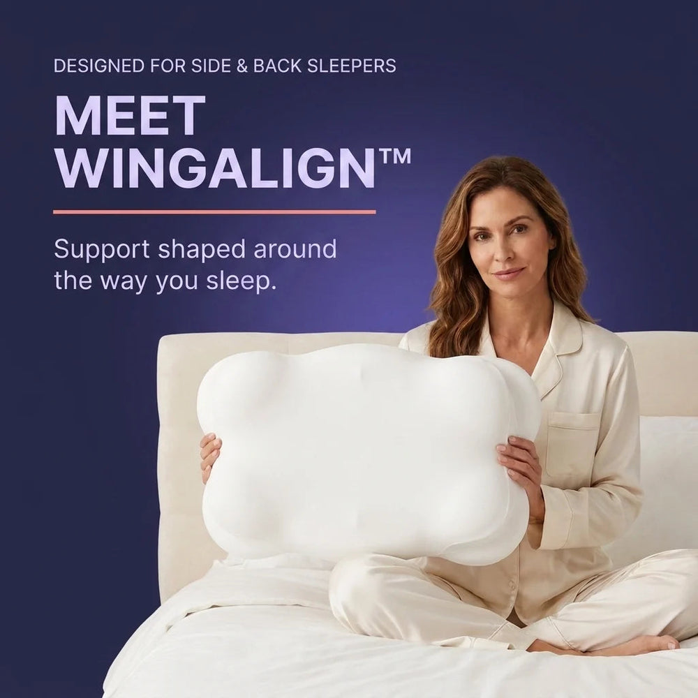 Meet WingAlign — designed for side and back sleepers. Support shaped around the way you sleep. A woman sits on a bed holding the sculpted pillow, showing its size.